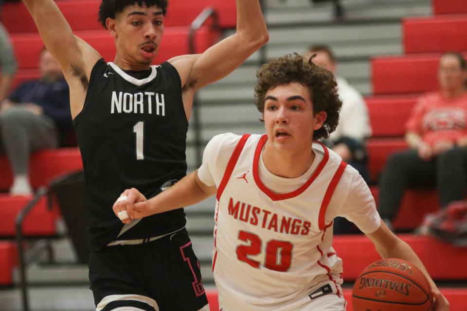 Jackson Green drives to the basket during the postseason opener against Des Moines North on Monday, Feb. 20, 2023, in Grimes.