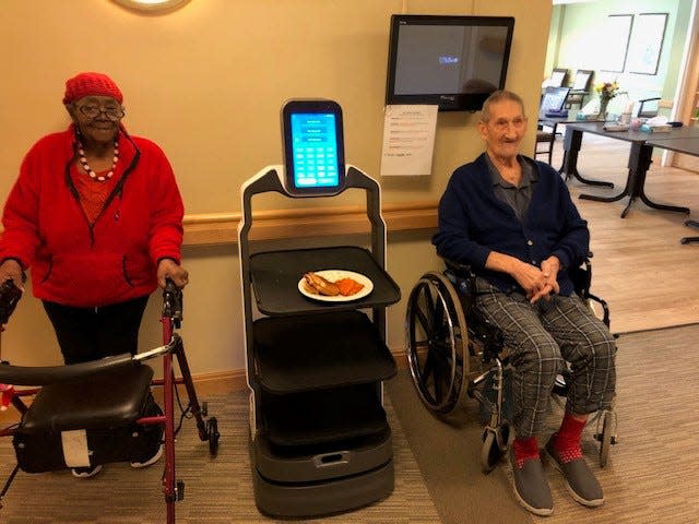 The delivery robot Rosie demonstrates how it assists residents at the Village of St. Edward in Fairlawn.
