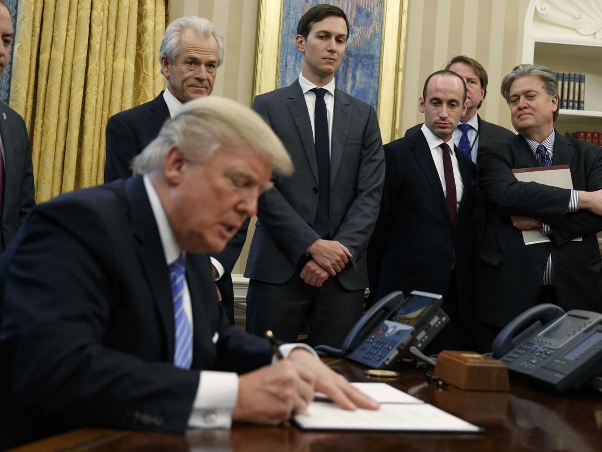 From left, White House Chief of Staff Reince Priebus, National Trade Council adviser Peter Navarro, Senior Adviser Jared Kushner, policy adviser Stephen Miller, and chief strategist Steve Bannon watch as President Donald Trump signs an executive order in the Oval Office of the White House: AP