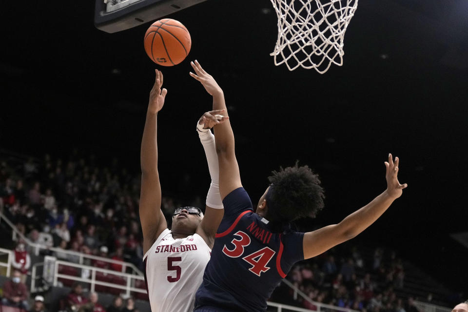 Stanford forward Francesca Belibi (5) shoots over Arizona forward Maya Nnaji (34) during the second half of an NCAA college basketball game Monday, Jan. 2, 2023, in Stanford, Calif. (AP Photo/Tony Avelar)