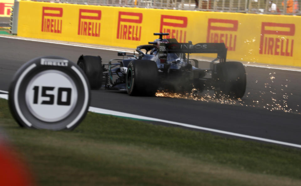 Mercedes driver Lewis Hamilton of Britain steers his car with flat tire during the British Formula One Grand Prix at the Silverstone racetrack, Silverstone, England, Sunday, Aug. 2, 2020. (AP Photo/Frank Augstein, Pool)