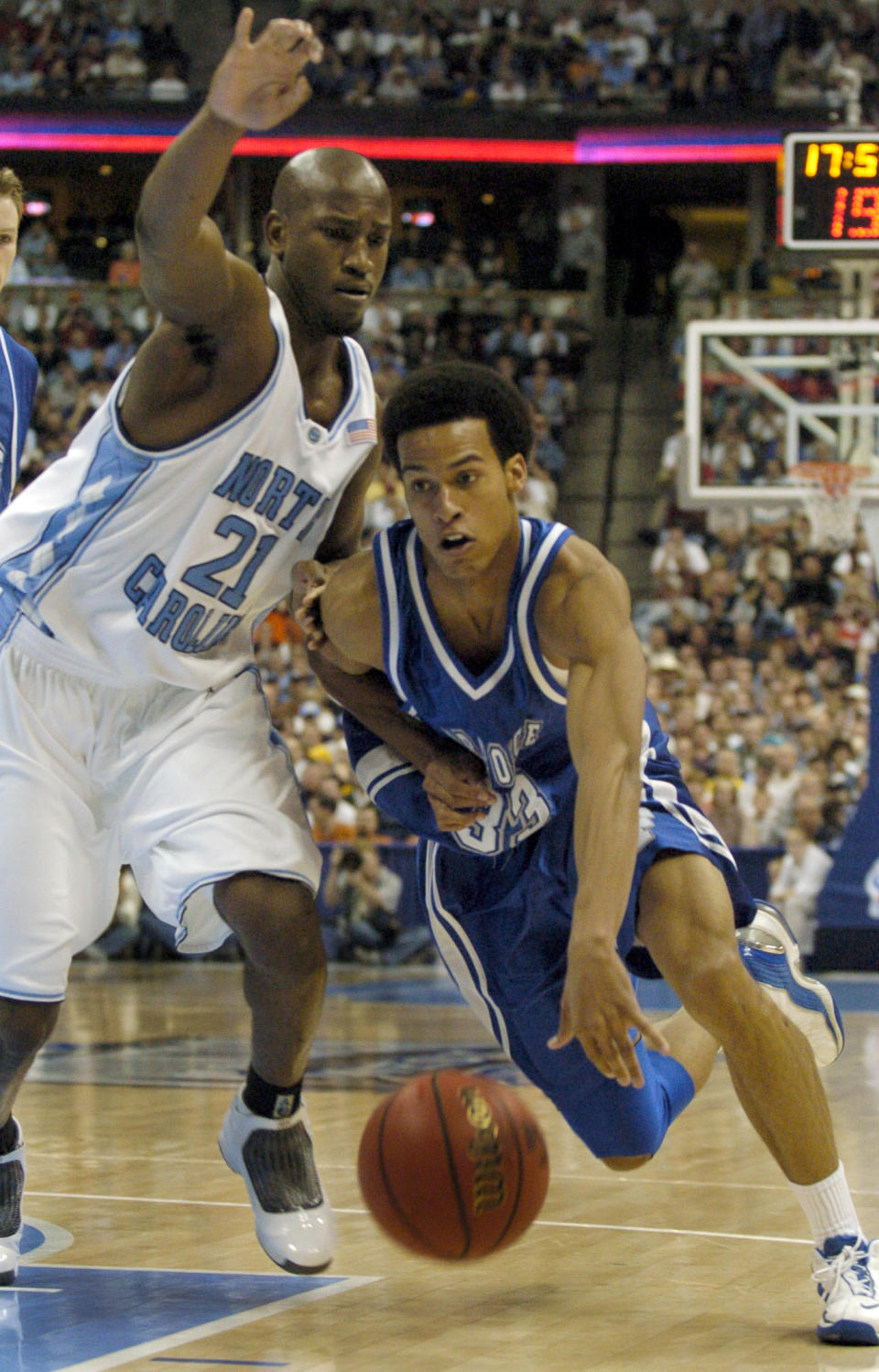 Air Force forward Joel Geriach drives past North Carolina forward Jawad Williams in Denver during the first round of the NCAA men’s college basketball tournament, Thursday, March 18, 2004. (AP Photo/Jeff Roberson)