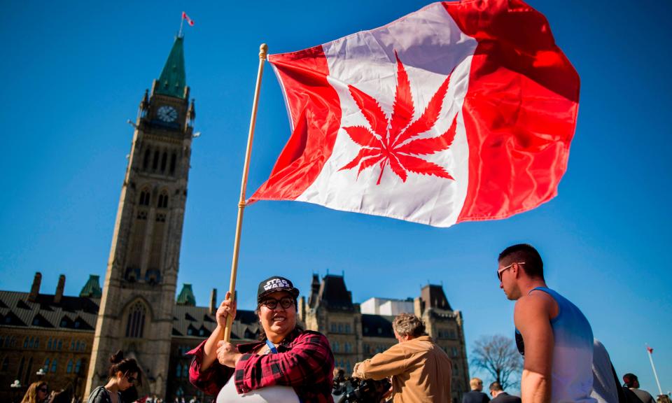 A Canadian flag with a marijuana leaf in the middle is seen on Parliament Hill. (The Guardian)