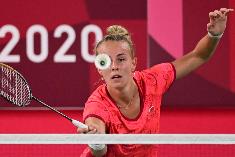 <p>Denmark's Mia Blichfeldt hits a shot to India's P. V. Sindhu in their women's singles badminton round of 16 match during the Tokyo 2020 Olympic Games at the Musashino Forest Sports Plaza in Tokyo on July 29, 2021. (Photo by Pedro PARDO / AFP)</p> 