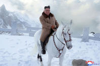 FILE - In this undated photo provided on Oct. 16, 2019, by the North Korean government, North Korean leader Kim Jong Un rides a white horse to climb Mount Paektu, North Korea. The content of this image is as provided and cannot be independently verified. Korean language watermark on image as provided by source reads: "KCNA" which is the abbreviation for Korean Central News Agency. (Korean Central News Agency/Korea News Service via AP, File)