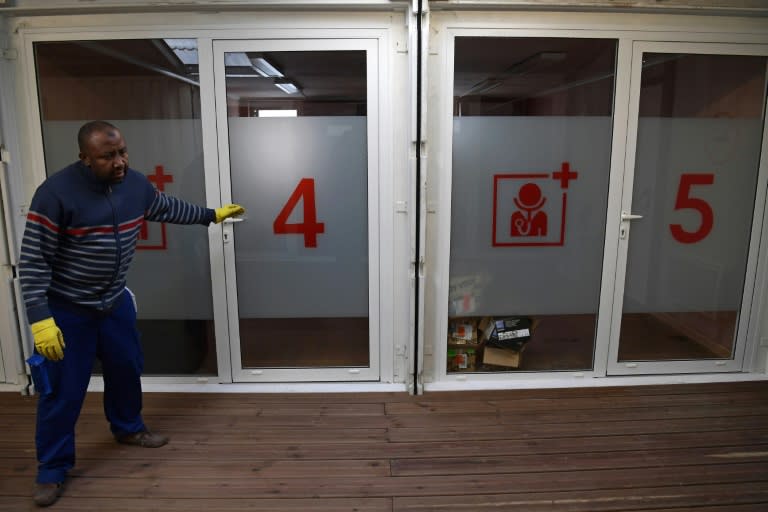 A worker checks medical facilities at a new refugee centre in northern Paris on November 8, 2016