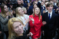 Supporters of Donald Tusk, a former Polish prime minister celebrate at his party headquarters in Warsaw, Poland, Sunday, Oct. 15, 2023. Poland's election result is on a knife edge as an exit poll says that the governing Law and Justice party won the most votes. (AP Photo/Petr David Josek)