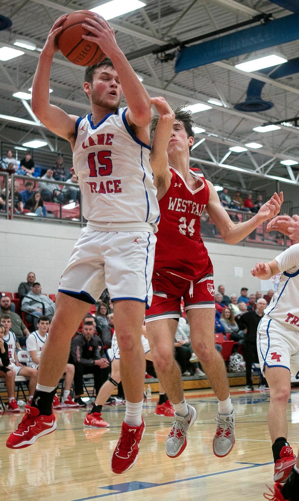 Zane Trace's Landon Robinson (15) comes down with the rebound against Westfall in varsity boys basketball action at Zane Trace High School on Feb. 13, 2024, in Chillicothe, Ohio. Zane Trace defeated Westfall 52-40.