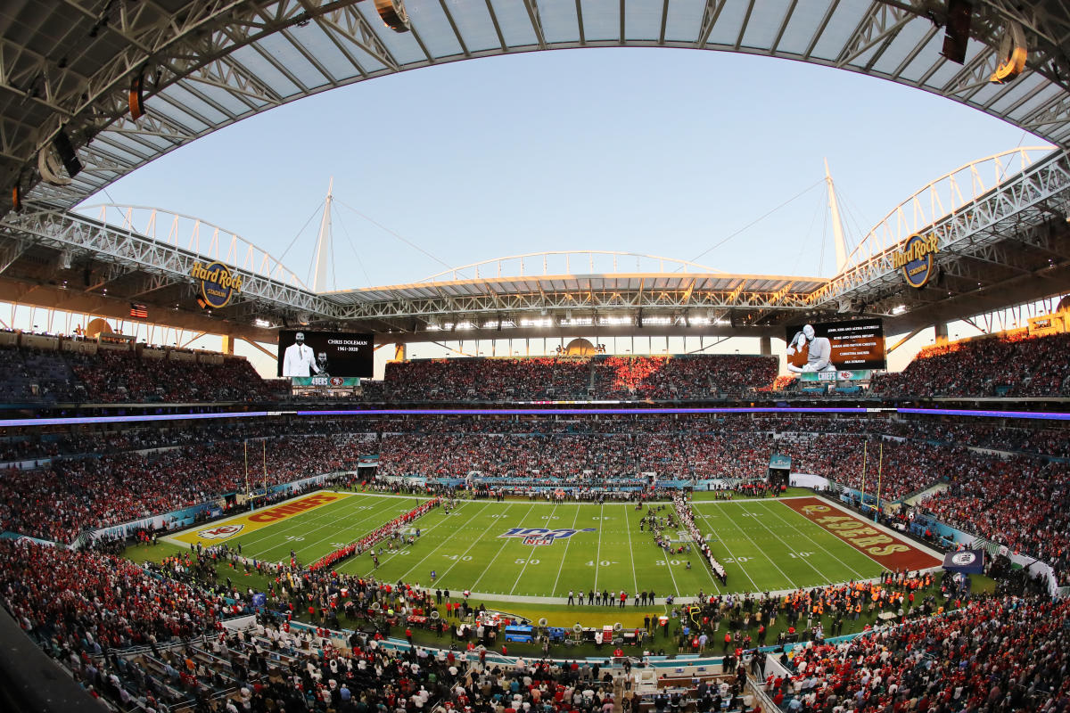 Players from Chiefs and 49ers line up along 24-yard line before