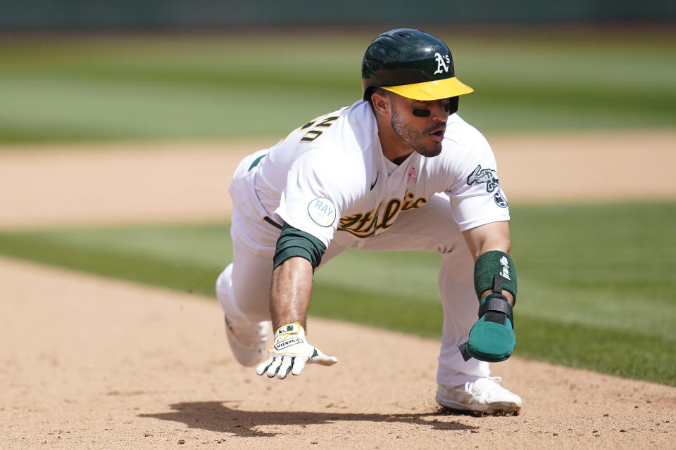 Oakland Athletics' Ramon Laureano steals third base during the fifth inning of a baseball game against the Los Angeles Angels in Oakland, Calif., Sunday, May 15, 2022. (AP Photo/Jeff Chiu)