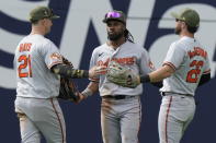 Baltimore Orioles center fielder Cedric Mullins, center, celebrates with teammates Austin Hays, left, and Ryan McKenna, right, after beating the Toronto Blue Jays, 8-3, during a baseball game in Toronto, Sunday, May 21, 2023. (Frank Gunn/The Canadian Press via AP)