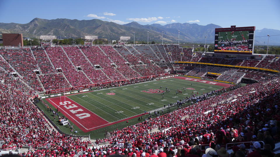 FILE - Weber State and Utah play during an NCAA college football game Rice-Eccles Stadium on Sept. 16, 2023, in Salt Lake City. College athletes in Utah who are looking to profit off their name, image and likeness will have to seek written approval from their school for any business deal exceeding $600 under a bill that received final legislative approval Friday, March 1, 2024, in the state Senate. (AP Photo/Rick Bowmer, File)