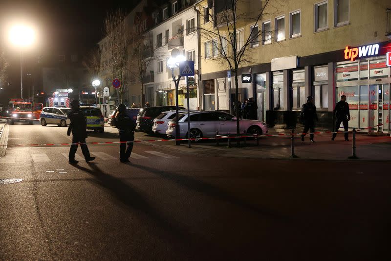 Police officers secure the area after a shooting in Hanau near Frankfurt