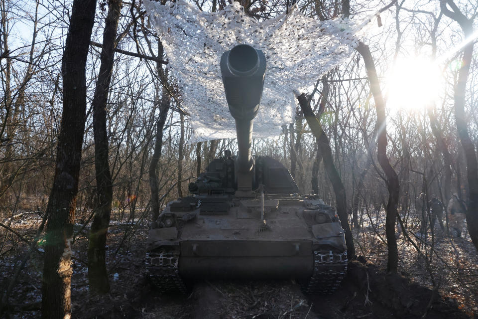 A German howitzer Panzerhaubitze 2000 is disguised by Ukrainian army of the 43rd Heavy Artillery Brigade, as Russia's attack on Ukraine continues, near Soledar, Ukraine, January 11, 2023. REUTERS/Clodagh Kilcoyne