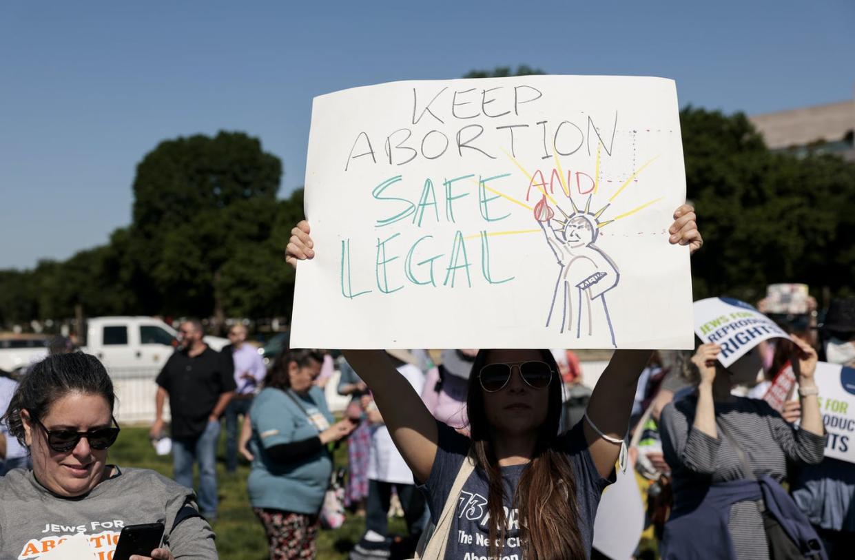 <span class="caption">The overturning of Roe will affet the lives of millions of women.</span> <span class="attribution"><a class="link " href="https://www.gettyimages.com/detail/news-photo/protester-carries-a-sign-as-they-attend-the-jewish-rally-news-photo/1397755254?adppopup=true" rel="nofollow noopener" target="_blank" data-ylk="slk:Anna Moneymaker/Getty Images;elm:context_link;itc:0;sec:content-canvas">Anna Moneymaker/Getty Images</a></span>