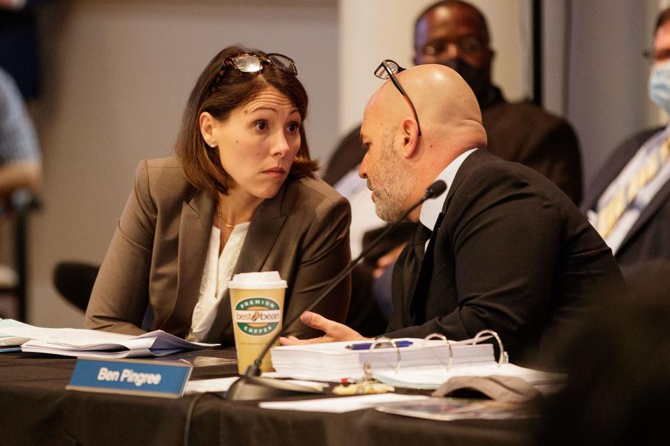 Cristina Paredes, Tallahassee-Leon County Office of Economic Vitality, reacts as Ben Pingree whispers to her during a Blueprint meeting at City Hall on Thursday, Feb. 24, 2022.