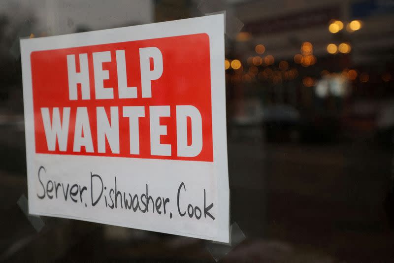 FILE PHOTO: A “Help Wanted” sign hangs in restaurant window in Medford