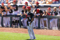 North Carolina State's J.T. Jarrett (15) celebrates after scoring off an RBI double hit by teammate Jonny Butler (14) against Stanford in the fourth inning in the opening baseball game of the College World Series, Saturday, June 19, 2021, at TD Ameritrade Park in Omaha, Neb. (AP Photo/Rebecca S. Gratz)