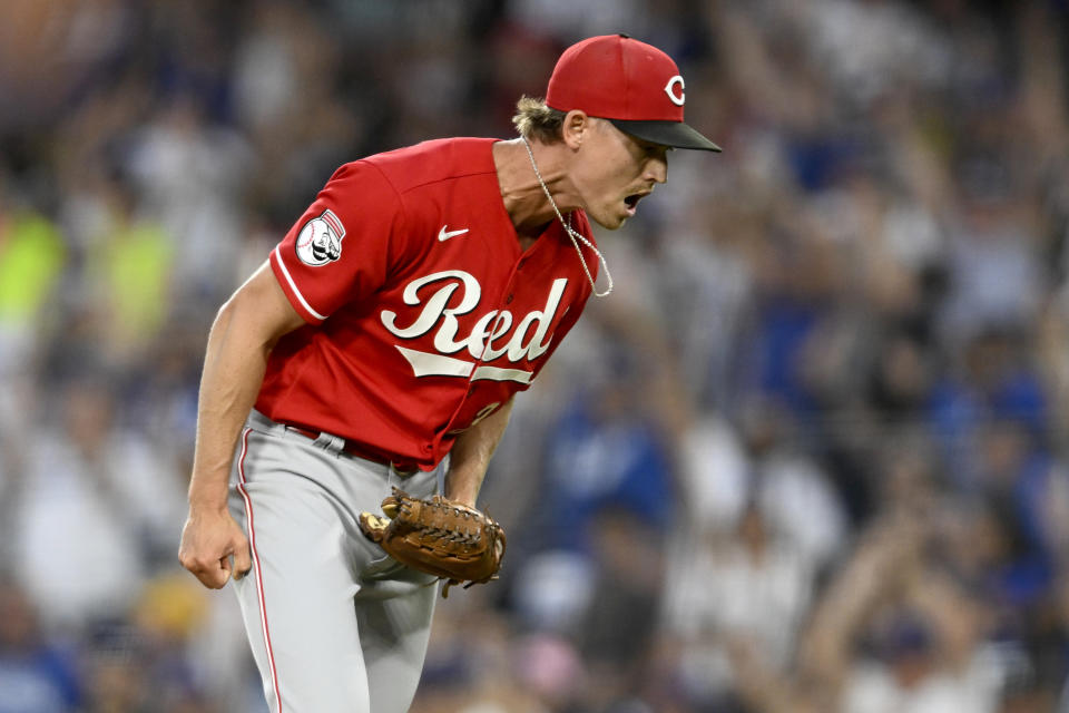 Cincinnati Reds starting pitcher Luke Weaver reacts after Los Angeles Dodgers' Max Muncy hit a solo home run during the sixth inning of a baseball game in Los Angeles, Saturday, July 29, 2023. (AP Photo/Alex Gallardo)