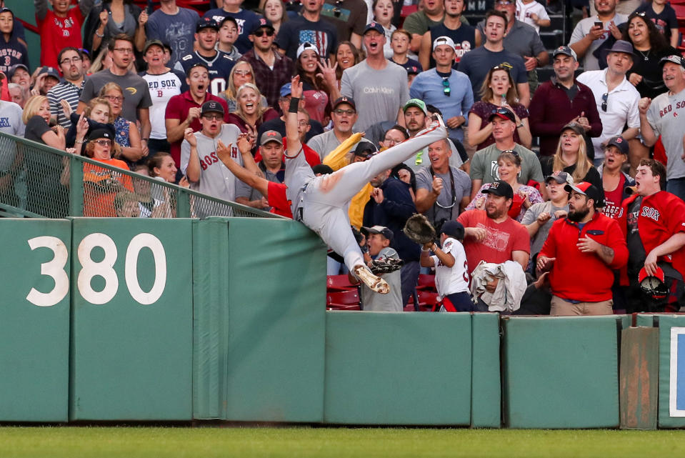 Sep 29, 2019; Boston, MA, USA; Baltimore Orioles center fielder Stevie Wilkerson (12) robs Boston Red Sox center fielder Jackie Bradley (not pictured) of a home run during the eighth inning against the Boston Red Sox at Fenway Park. Mandatory Credit: Paul Rutherford-USA TODAY Sports     TPX IMAGES OF THE DAY