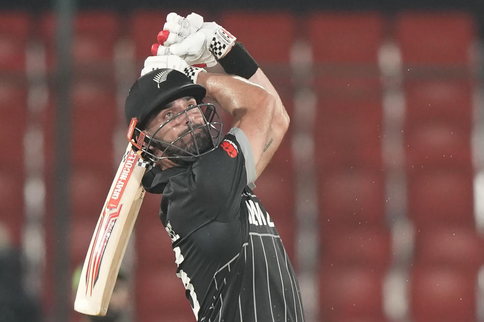 New Zealand's Daryl Mitchell plays a shot during the ICC Cricket World Cup warmup match between New Zealand and Pakistan in Hyderabad, India, Friday, Sept. 29, 2023. (AP Photo/Mahesh Kumar A.)