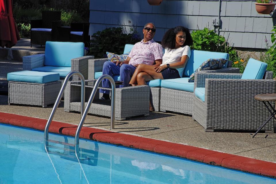 Ceasar McDowell and wife Solmaz Celik McDowell of Brockton take a moment to relax after having gotten their pool ready for clients who have scheduled a time to rent it for recreational swimming on Wednesday, Aug. 3, 2022.
