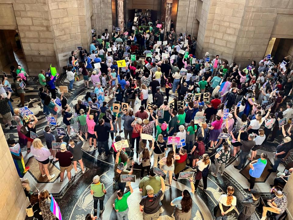 Hundreds of people filled the Nebraska Capitol in Lincoln on 16 May chanting ‘one vote to save our lives’ in protest of a measure targeting abortion rights and gender-affirming care for trans youth. (AP)