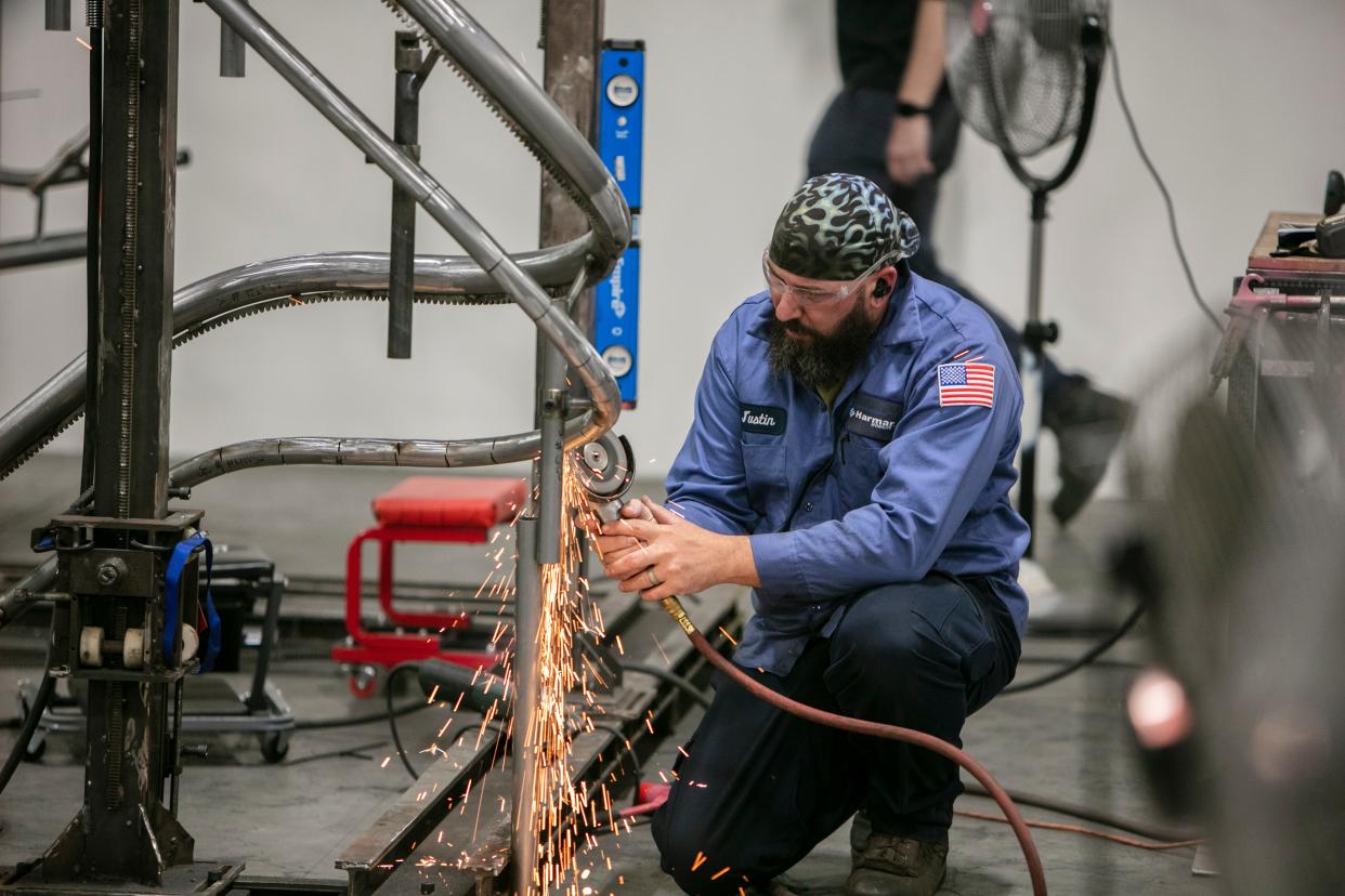 An employee works at the Harmar Mobility plant at 1500 Independence Blvd., Suite 200, Sarasota. Harmar produces lifts for vehicles, stairs and platforms.