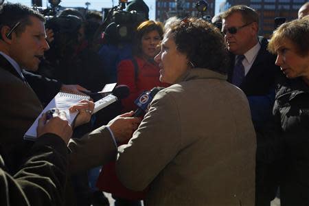 Juror Janet Uhlar-Tinney talks to reporters outside the courthouse on the first of two days of convicted mobster James "Whitey" Bulger's sentencing hearing in Boston, Massachusetts November 13, 2013. REUTERS/Brian Snyder