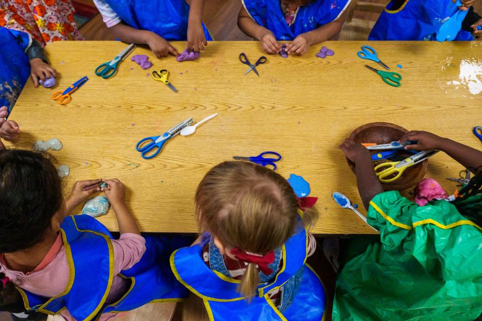 Students in Pamela Brim's preschool classroom play with slime on Friday, December 2, 2022, at St. Mary's. 