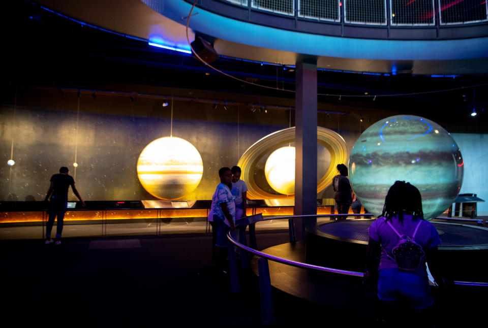 Children learn about the planets at the Adventure Science Center in Nashville.