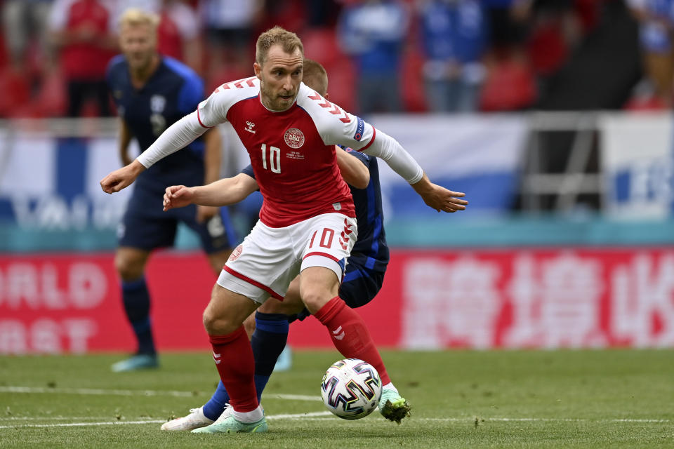 Denmark's Christian Eriksen controls the ball during the Euro 2020 soccer championship group B match between Denmark and Finland at Parken Stadium in Copenhagen, Saturday, June 12, 2021. (Stuart Franklin/Pool via AP)