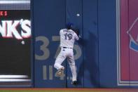 Oct 17, 2016; Toronto, Ontario, CAN; Toronto Blue Jays right fielder Jose Bautista (19) deflects the ball hit by Cleveland Indians first baseman Mike Napoli (not pictured) for a RBI-double during the first inning in game three of the 2016 ALCS playoff baseball series at Rogers Centre. Mandatory Credit: Nick Turchiaro-USA TODAY Sports