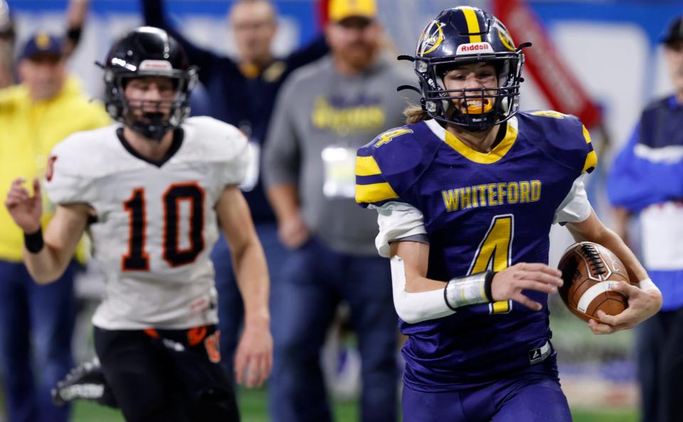 Ottawa Lake Whiteford's Hunter DeBarr (4) runs in for the touchdown as Ubly's Evan Peruski can't catch him during the first half of the Division 8 high school football finals Nov. 25, 2022 at Ford Field in Detroit.