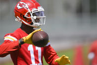 Kansas City Chiefs wide receiver Marquez Valdes-Scantling throws the ball back during the NFL football team's mandatory minicamp Tuesday, June 14, 2022, in Kansas City, Mo. (AP Photo/Reed Hoffmann)