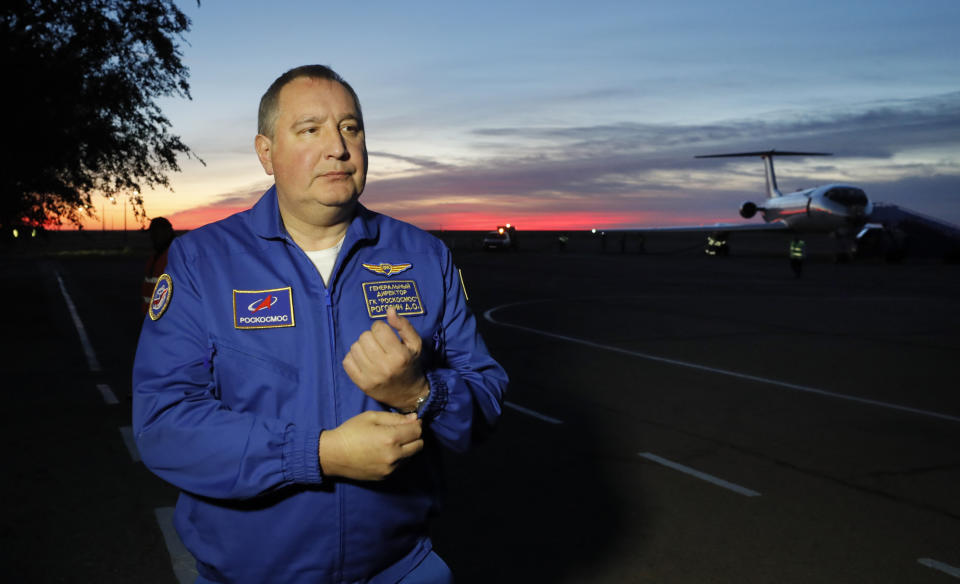 Director General of the Russia state corporation Roscosmos Dmitry Rogozin walks in Baikonur airport after a rescue operation for NASA astronaut Nick Hague and Russian cosmonaut Alexey Ovchinin after an emergency landing, in Kazakhstan, Thursday, Oct. 11, 2018. Two astronauts from the U.S. and Russia were safe Thursday after an emergency landing in the steppes of Kazakhstan following the failure of a Russian booster rocket carrying them to the International Space Station. (Yuri Kochetkov/Pool Photo via AP)