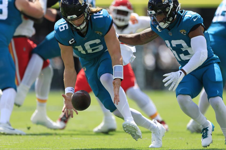 Jacksonville Jaguars quarterback Trevor Lawrence (16) bobbles the ball in the backfield as wide receiver Christian Kirk (13) looks on during the first quarter of a NFL football game Sunday, Sept. 17, 2023 at EverBank Stadium in Jacksonville, Fla. [Corey Perrine/Florida Times-Union]