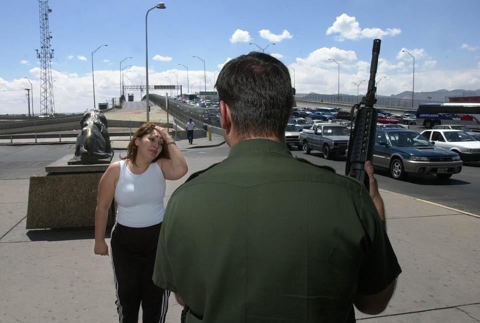 A woman from Juarez, Mexico, reacts after being denied access to a border crossing visa by a Border Patrol agent guarding the international bridge Tuesday, Sept. 11, 2001, in El Paso, Texas. Tighter security was applied to the U.S.'s southern border with Mexico after Tuesday's attacks on the World Trade Center and the Pentagon building, but bridges linking the border were kept open.