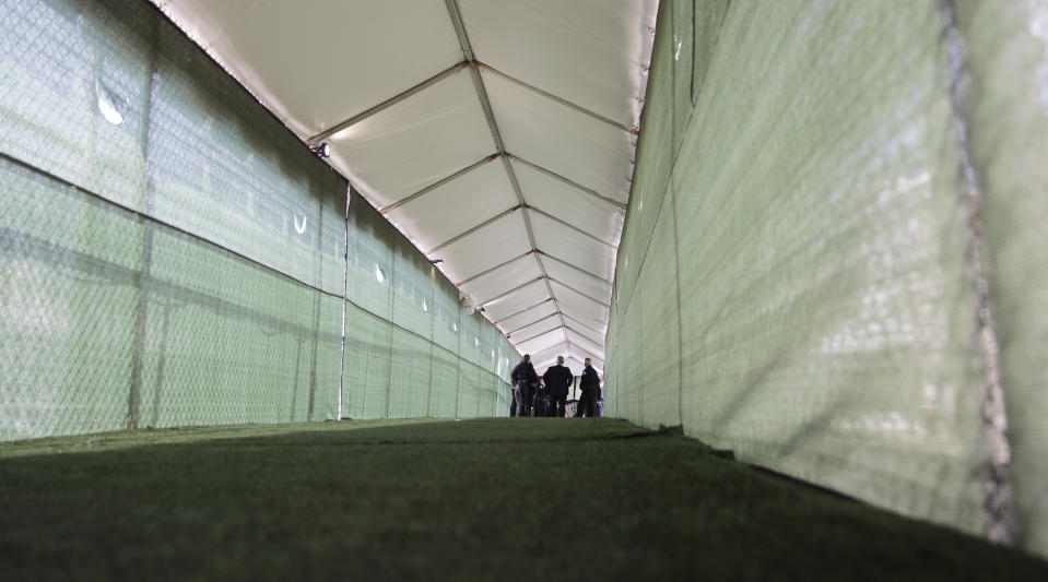 U.S. Department of Homeland Security Acting Secretary Kevin McAleenan and other officials take a walkthrough of the Migration Protection Protocols Immigration Hearing Facility, a new tent court, Tuesday, Sept. 17, 2019, in Laredo, Texas. (AP Photo/Eric Gay)