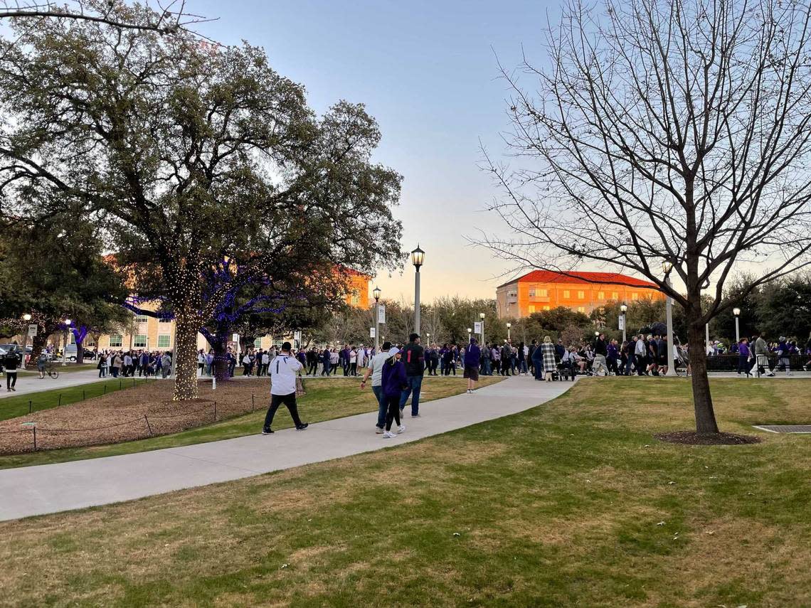 Horned Frogs football fans enter Schollmaier Arena on the TCU campus in Fort Worth for a watch party to cheer on the TCU team as they play Georgia for the national championship Monday, Jan. 9, 2023.