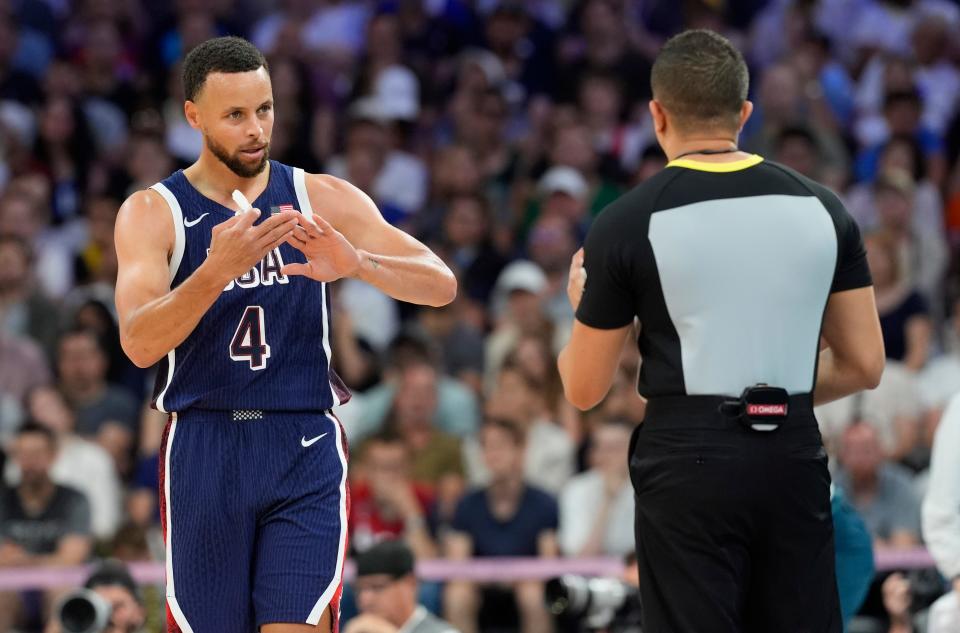 Jul 28, 2024; Villeneuve-d'Ascq, France; United States shooting guard Stephen Curry (4) talks to an official in the second quarter against Serbia during the Paris 2024 Olympic Summer Games at Stade Pierre-Mauroy. Mandatory Credit: John David Mercer-USA TODAY Sports