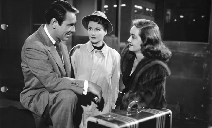 Three people talk in All About Eve.