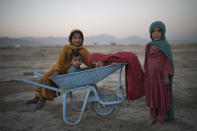 Children pose for a photo as they play in a camp for internally displaced people in Kabul, Afghanistan, Monday, Sept. 13, 2021. (AP Photo/Felipe Dana)