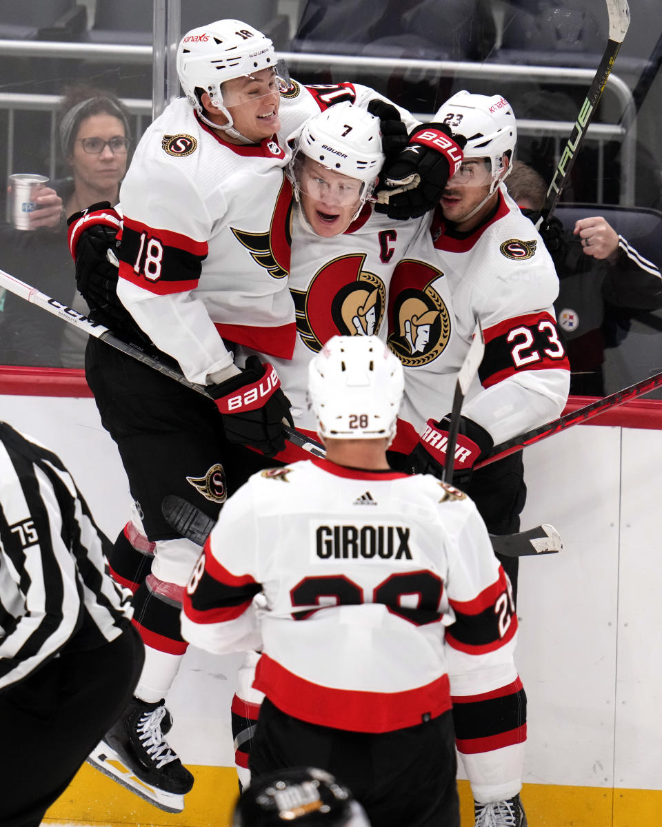 Ottawa Senators' Brady Tkachuk (7) celebrates after his goal with Tim Stutzle (18), Travis Hamonic (23) and Claude Giroux (28) during the third period of an NHL hockey game against the Pittsburgh Penguins in Pittsburgh, Saturday, Oct. 28, 2023. It was Tkachuk's second goal of the game. (AP Photo/Gene J. Puskar)