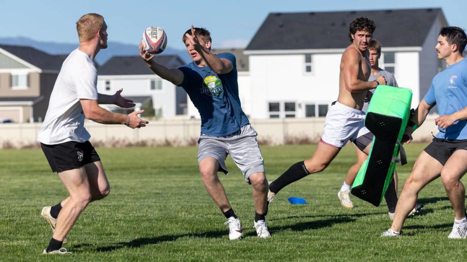 Porter Rich makes a pass during practice with the U19 TOA Rugby Idaho team at Owyhee High.