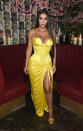 <p>After wearing Versace at the Met Ball, Kim carried on her love affair with the brand the night after wearing a vintage Versace Spring 1995 dress in vibrant yellow.<br><em>[Photo: Getty]</em> </p>