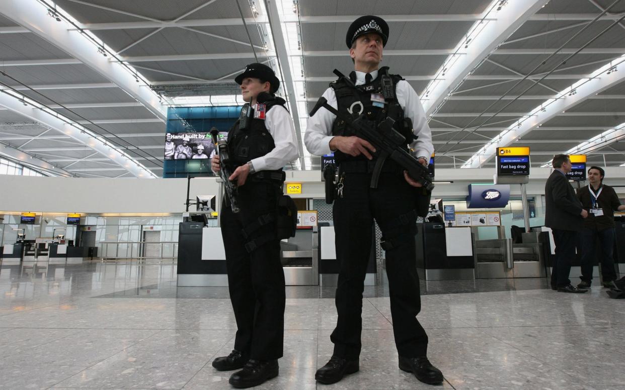 Armed police officers patrol the new Terminal 5 at Heathrow Airport - Getty Images