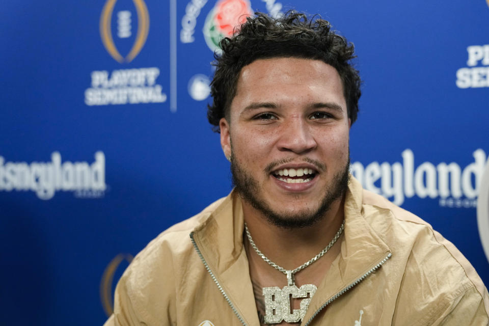 Michigan running back Blake Corum listens during a welcome event for the team at Disneyland on Wednesday, Dec. 27, 2023, in Anaheim, Calif. Michigan is scheduled to play against Alabama on New Year's Day in the Rose Bowl, a semifinal in the College Football Playoff. (AP Photo/Ryan Sun)