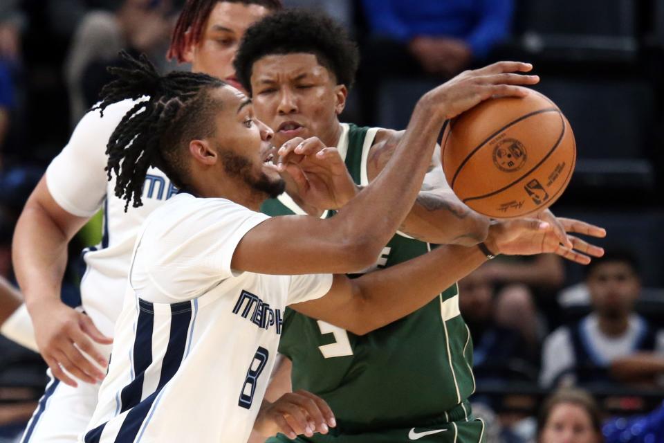 Bucks forward MarJon Beauchamp defends Grizzlies vigorously forward Ziaire Williams on a drive to the basket Tuesday night.