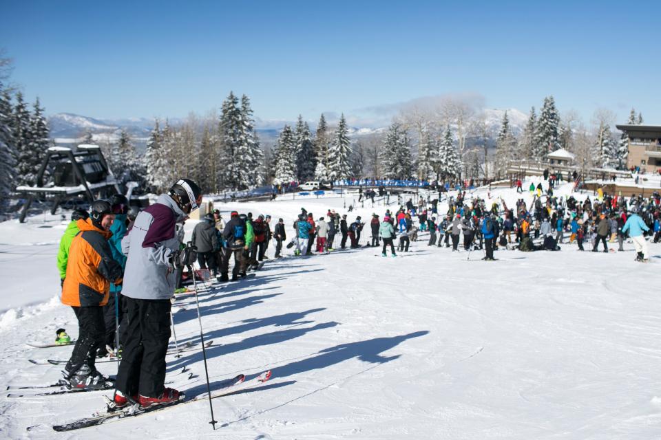 Skiers and snowboarders wait in line to ride the lift at Arizona Snowbowl on the mountain's opening day in Flagstaff on Nov. 22, 2019. The ski resort received 22 inches of fresh snow in the week leading to its season opening. 